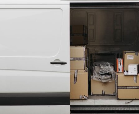 Interior of a delivery van with various packages stacked inside