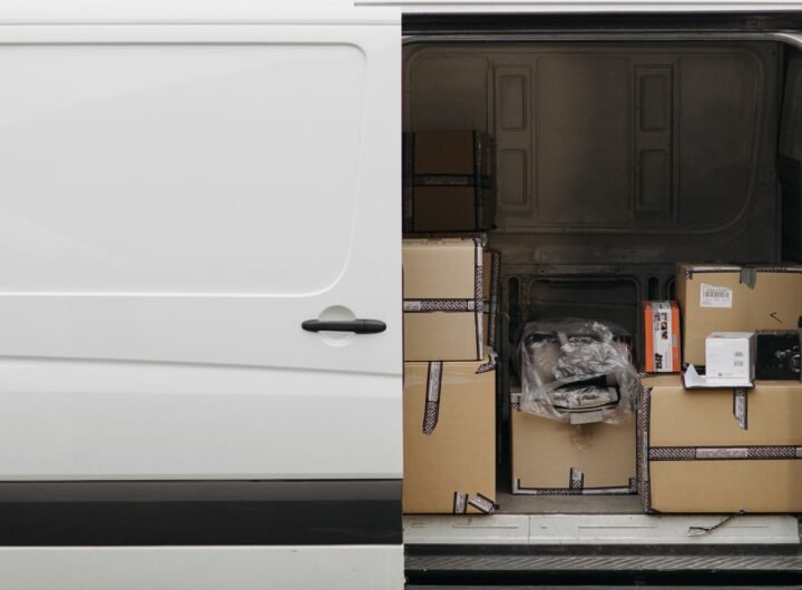 Interior of a delivery van with various packages stacked inside